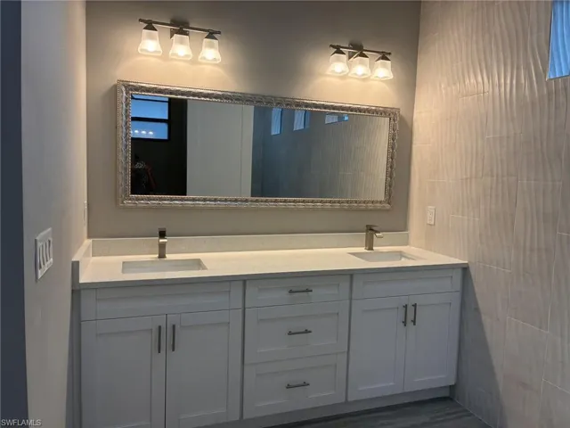Bathroom featuring double vanity