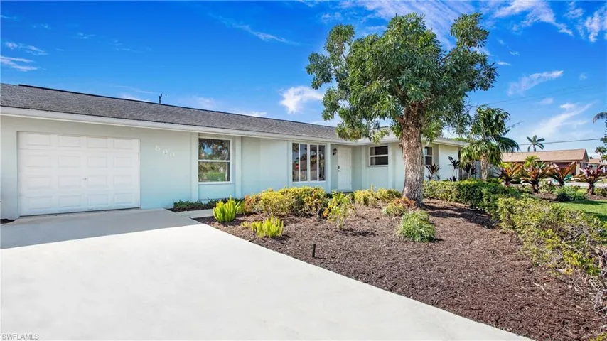 Single story home featuring stucco siding, driveway, and an attached garage
