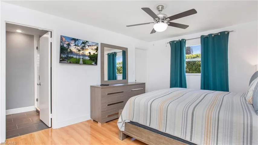 Bedroom featuring light wood finished floors and a ceiling fan