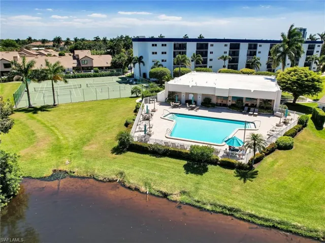 View of swimming pool featuring a lawn and a patio area