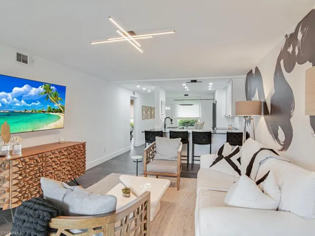 Living area with recessed lighting, baseboards, and visible vents