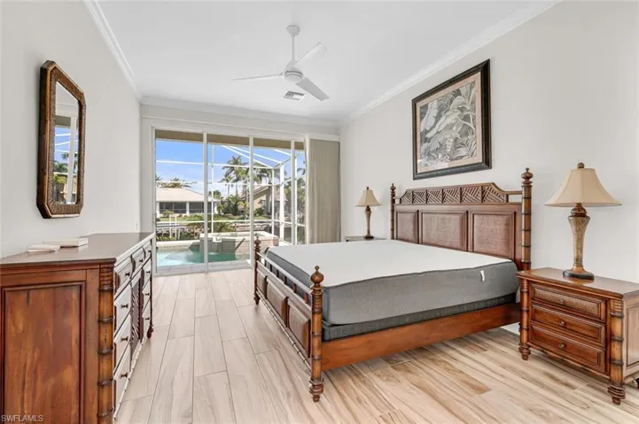 Bedroom with ornamental molding, access to outside, ceiling fan, and light hardwood / wood-style flooring