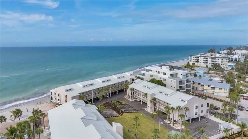 Aerial view of waterfront with a beach