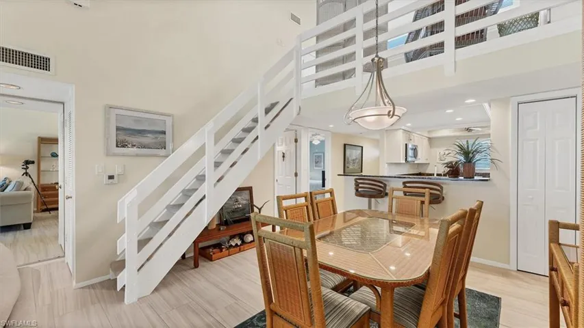 Dining area featuring stairway, recessed lighting