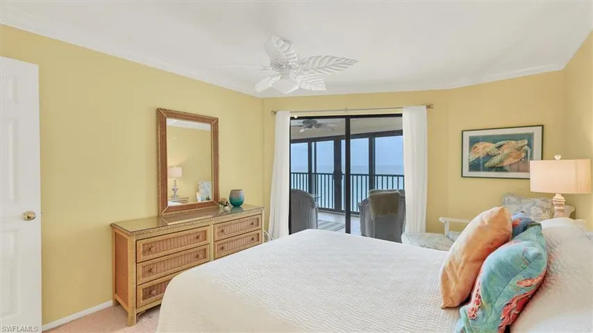 Bedroom featuring access to exterior, ceiling fan, crown molding, and light carpet