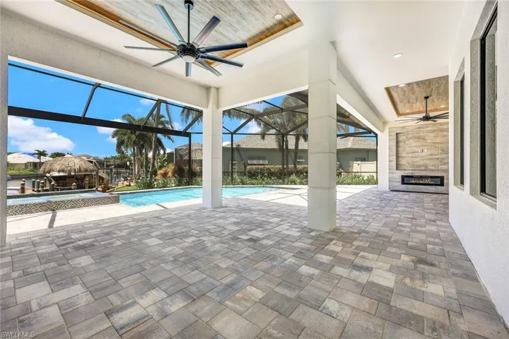 View of patio / terrace with ceiling fan and glass enclosure