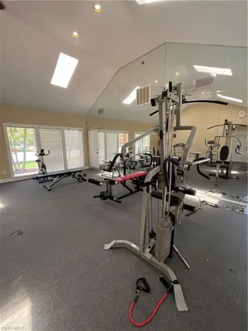 Exercise room with vaulted ceiling