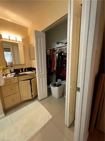 Bathroom with vanity and tile patterned flooring