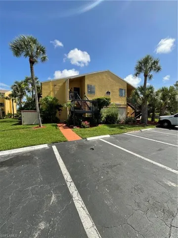 View of car parking with a yard