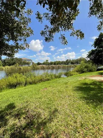 View of yard with a water view