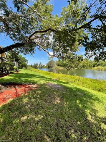 View of yard with a water view