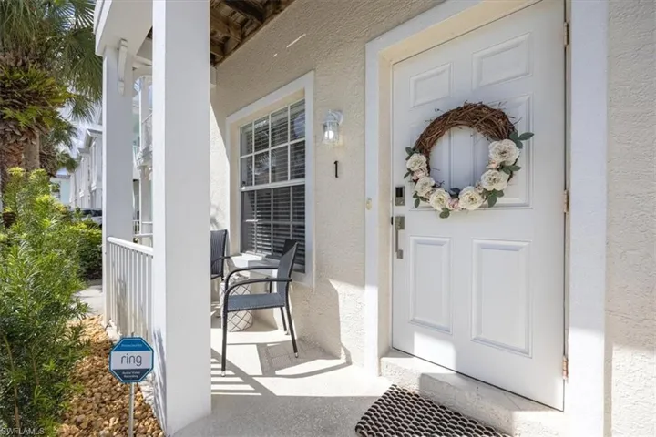 View of exterior entry featuring a porch