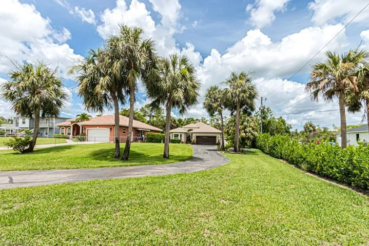 View of yard with a garage