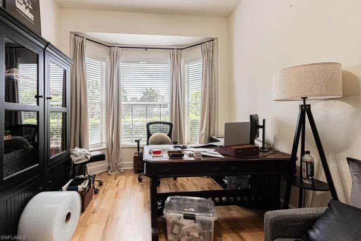 Office area with light wood-type flooring and healthy amount of natural light