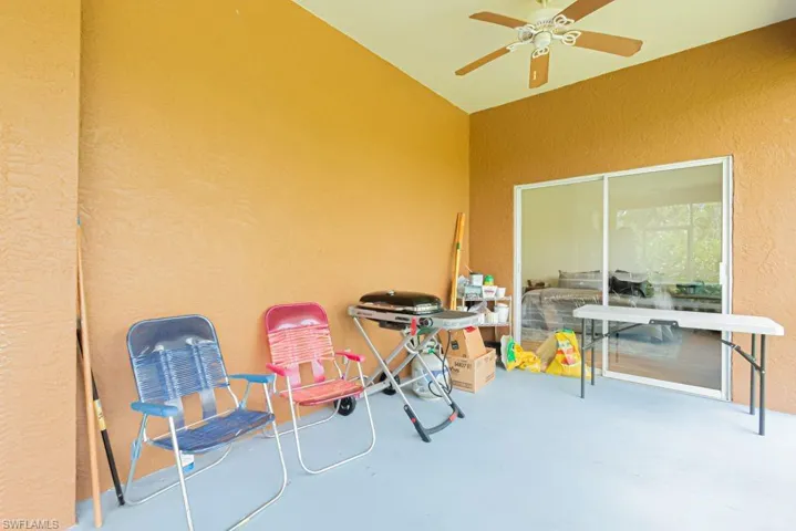View of patio featuring ceiling fan