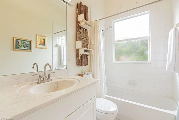Full bathroom with vanity and shower / tub combo with curtain