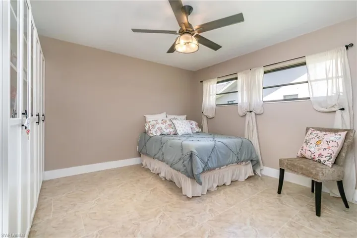 Bedroom featuring baseboards and a ceiling fan