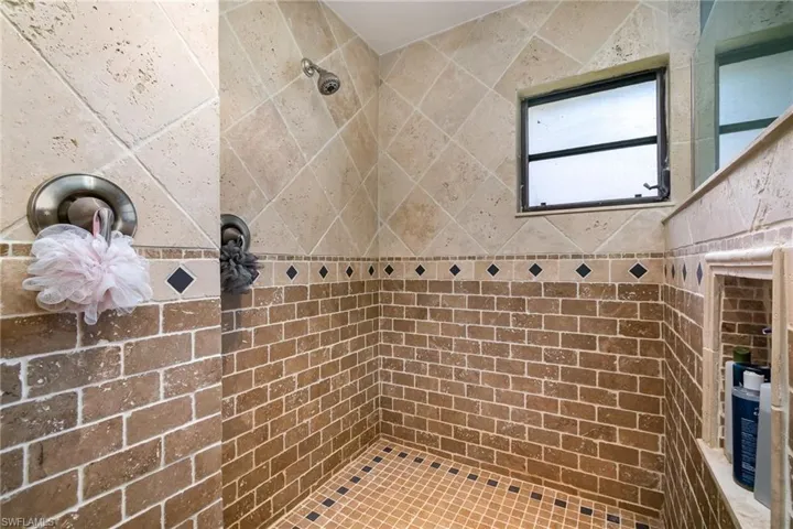 Full bath with tiled shower