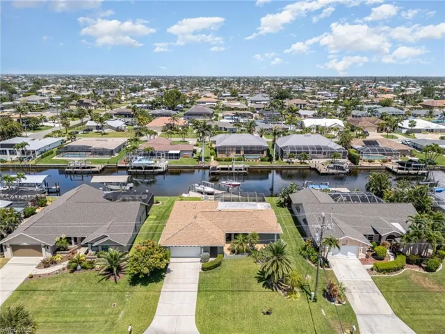 Drone / aerial view with a water view and a residential view
