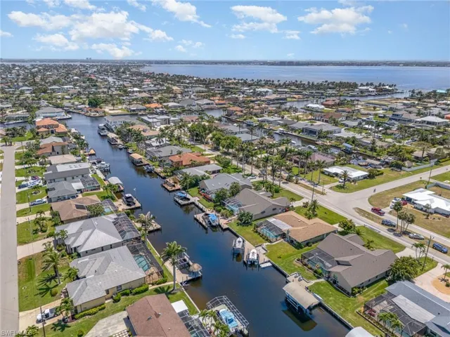 Aerial view with a water view and a residential view