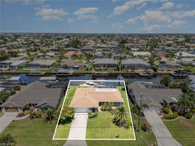 Drone / aerial view with a water view and a residential view