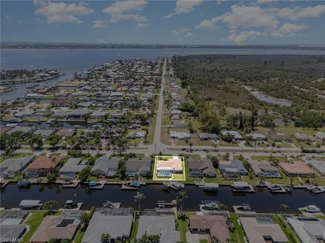 Drone / aerial view featuring a water view and a residential view