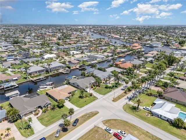 Aerial view with a water view and a residential view