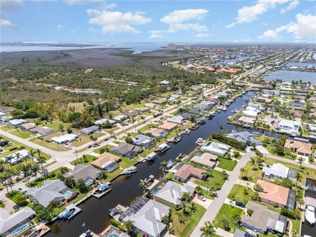 Bird's eye view with a water view and a residential view