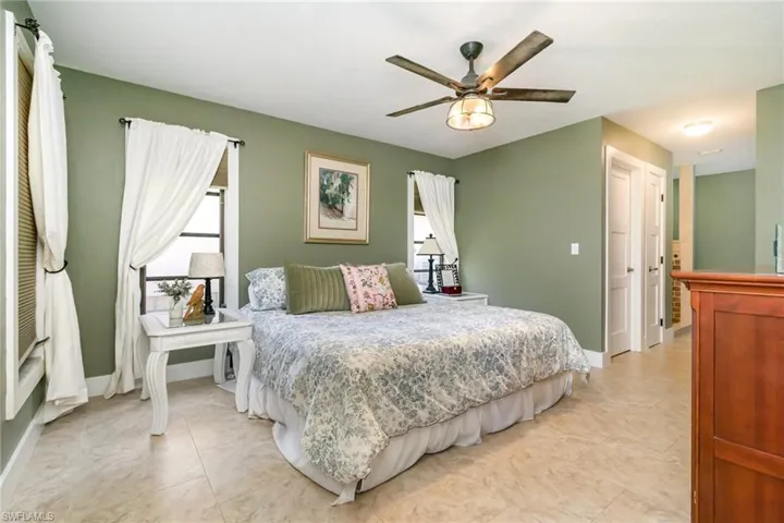 Bedroom featuring baseboards and ceiling fan