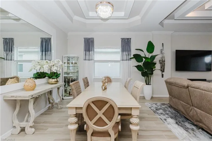 Tray ceiling with crown molding and chandelier