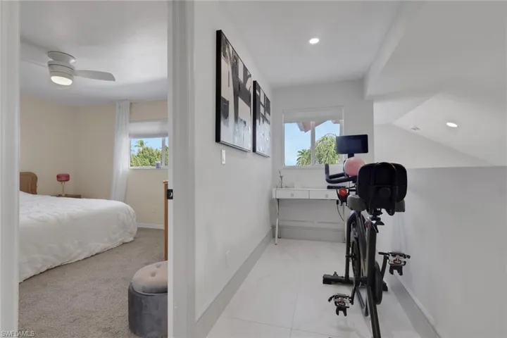 Small den area for desk and exercise bike upstairs overlooking the lake