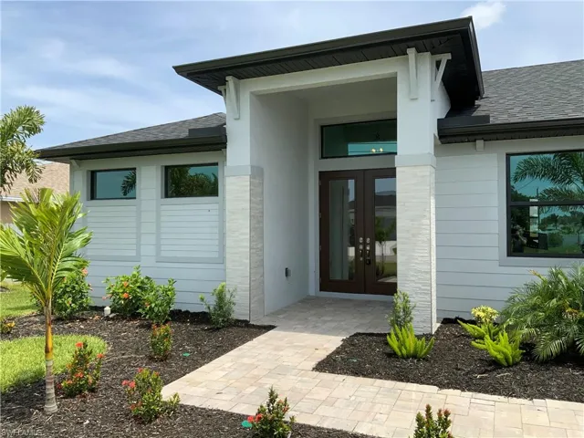View of exterior entry featuring french doors