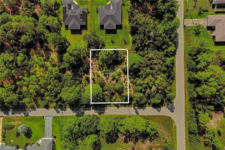Aerial overview of property's location with property parcel outlined