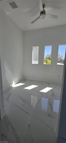 Spare room with a ceiling fan