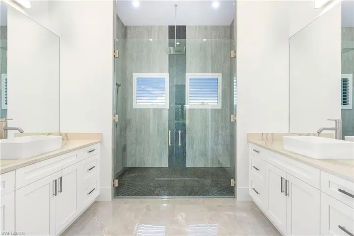 Bathroom with vanity and an enclosed shower