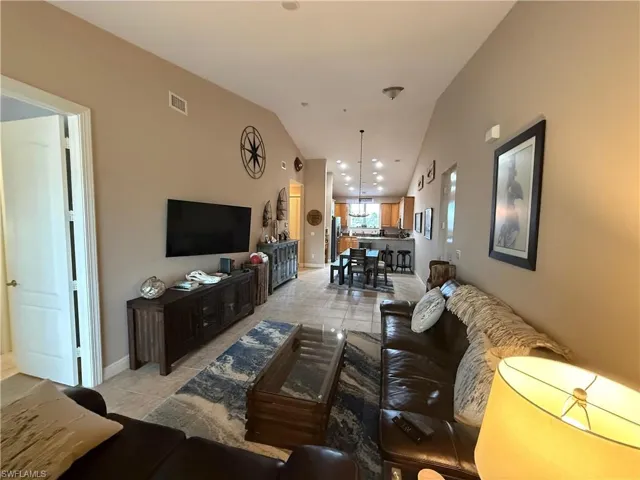 Open floor plan. Living and dining area with vaulted ceilings