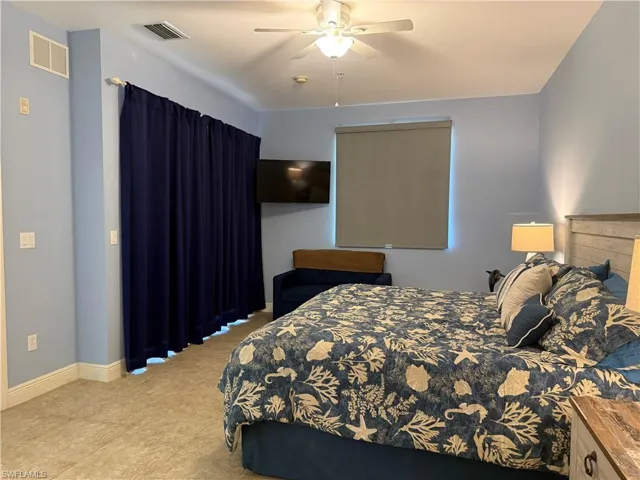 Master bedroom with direct balcony access and water/pool view