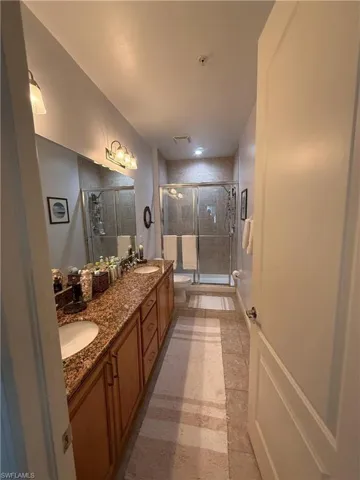 Master bathroom.  2 sinks, walk-shower