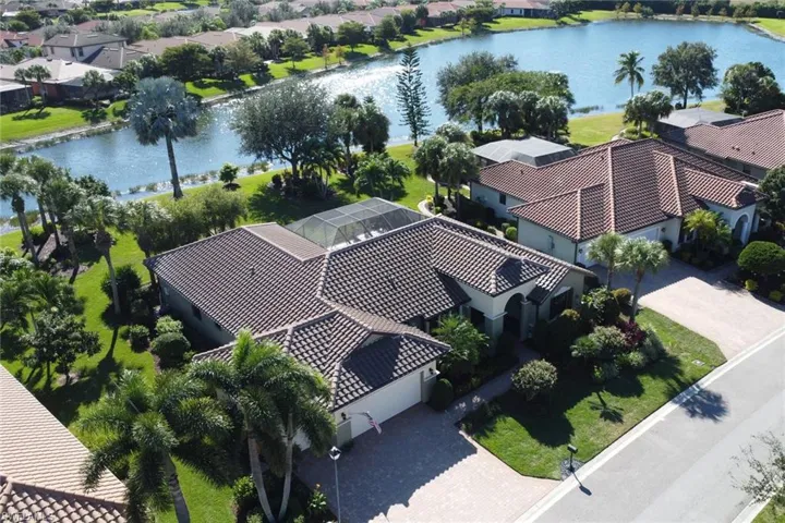 Aerial perspective of suburban area with a large body of water