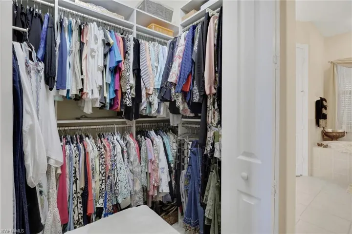 Spacious closet featuring tile patterned flooring