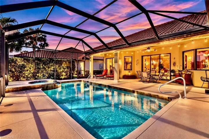 The property features a screened-in lanai with a swimming pool and an integrated spa