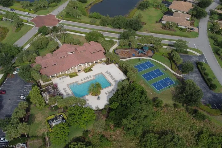 View of property location with a pool and a large body of water