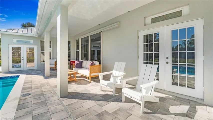 View of patio featuring french doors, an outdoor pool, and an outdoor hangout area