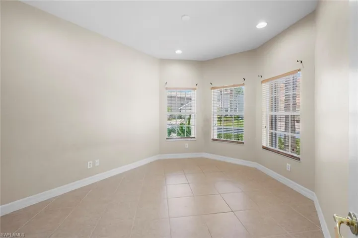Unfurnished room with light tile patterned flooring and recessed lighting