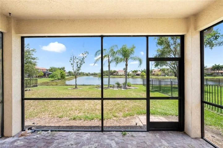 Unfurnished sunroom featuring a water view