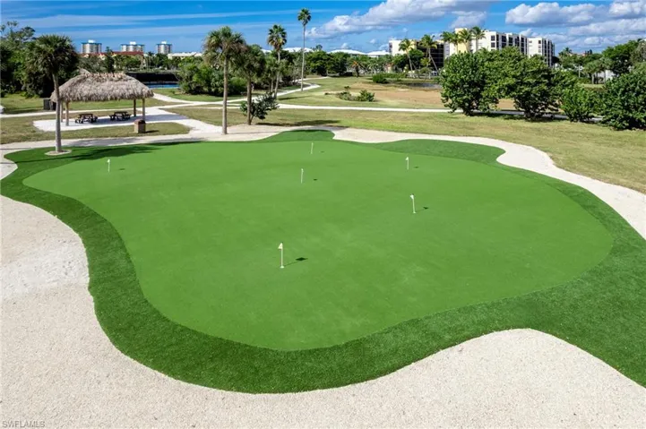 EBIA member  bay beach commons amenities featuring a putting green, a tiki hut, and walking