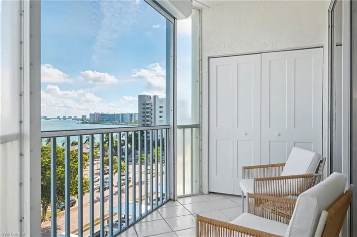 Balcony featuring a view of the community and Estero Bay