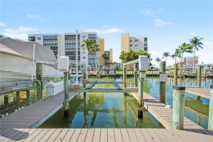 Dock area featuring a water view and boat lift