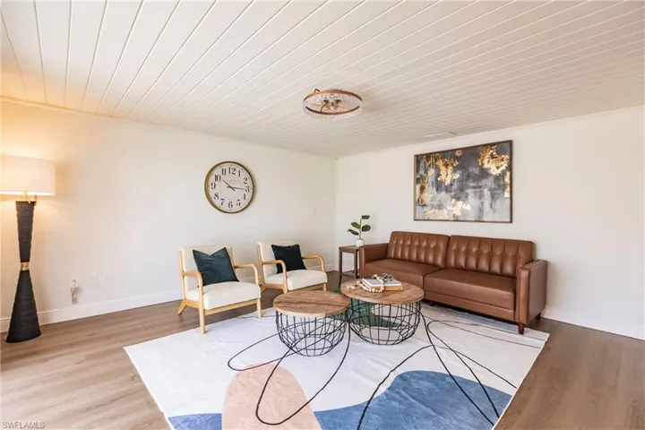 Living room featuring wooden ceiling and hardwood / wood-style flooring