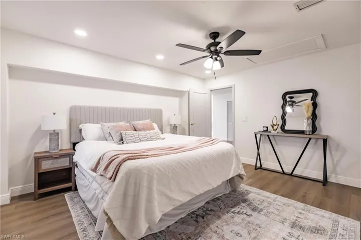 Bedroom with wood-type flooring and ceiling fan